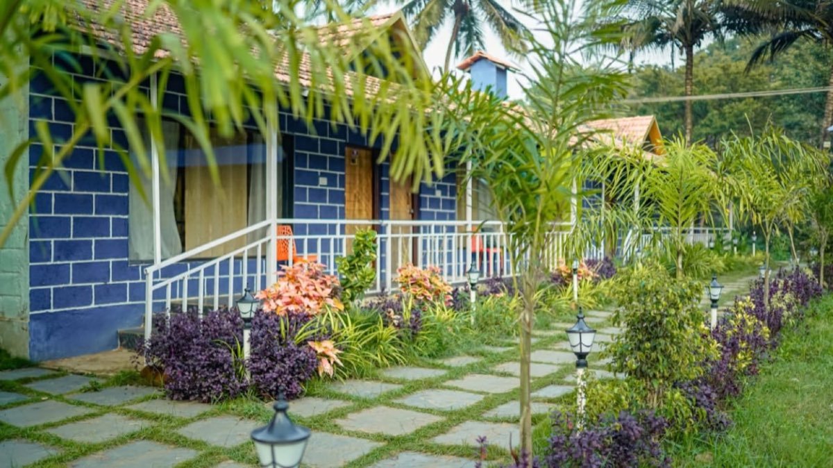Eco Green cottages with garden pathway and lanterns