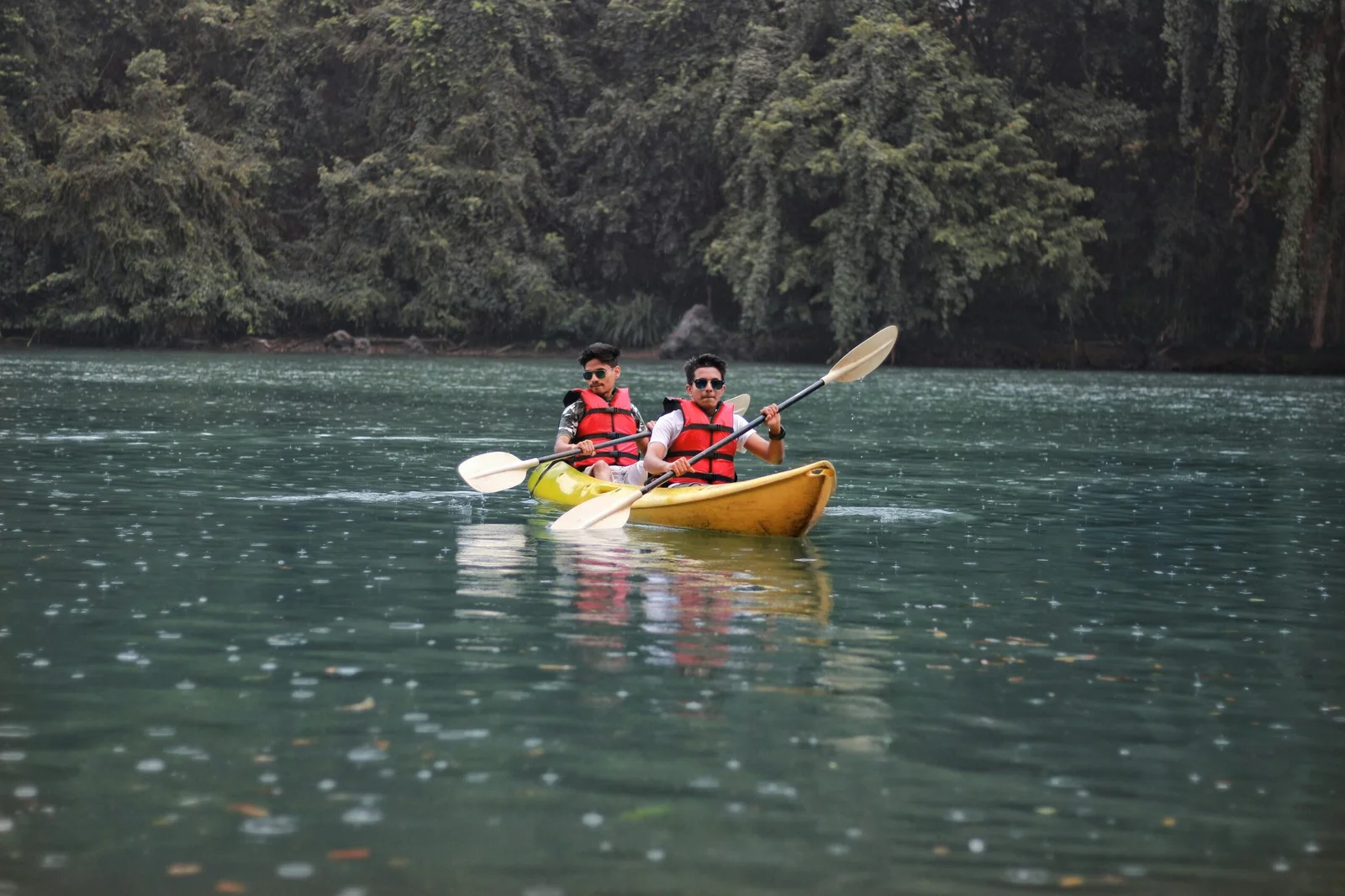 Guests kayaking through the calm Kali river