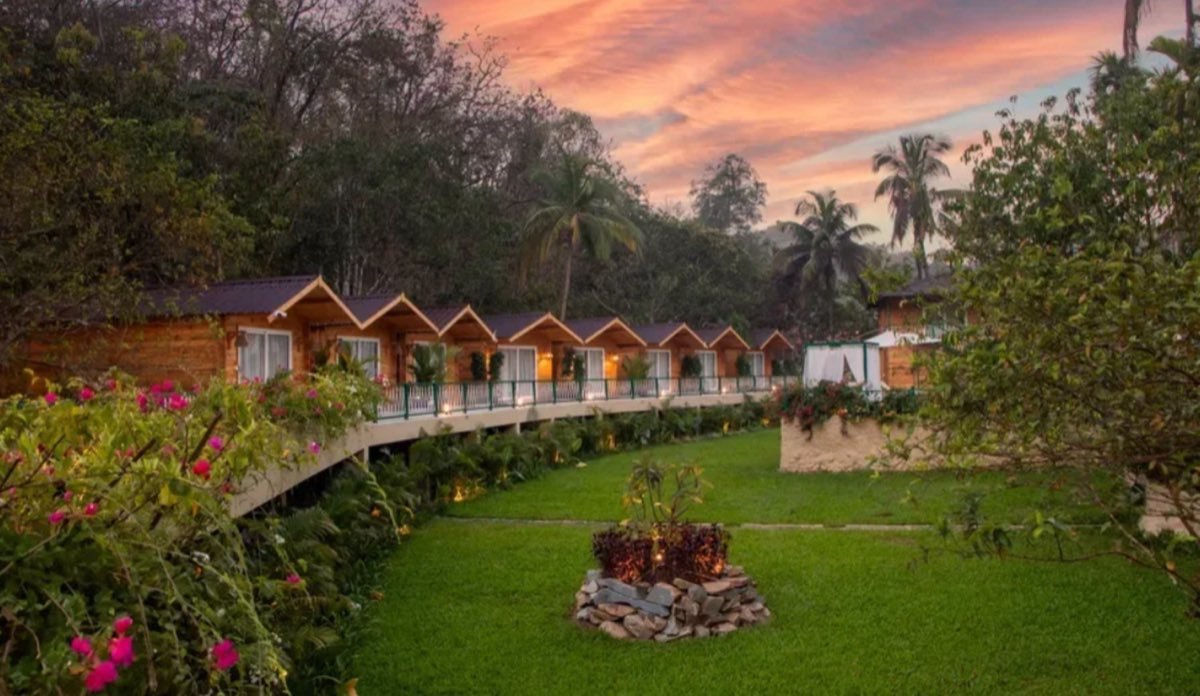 Riverside cottages at sunset with bonfire pit