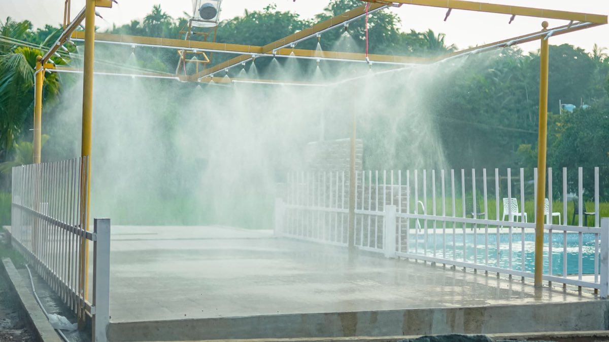 Rain dance misting arena beside the pool