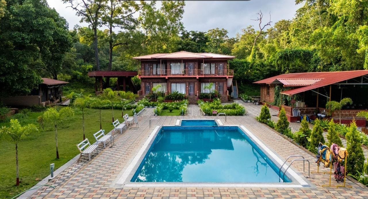 Swimming pool in front of the two-storey duplex block at Wild Wings
